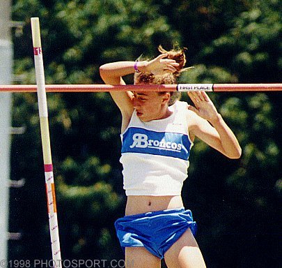 High school polevaulter in close brush with bar! Please wait for image to load.